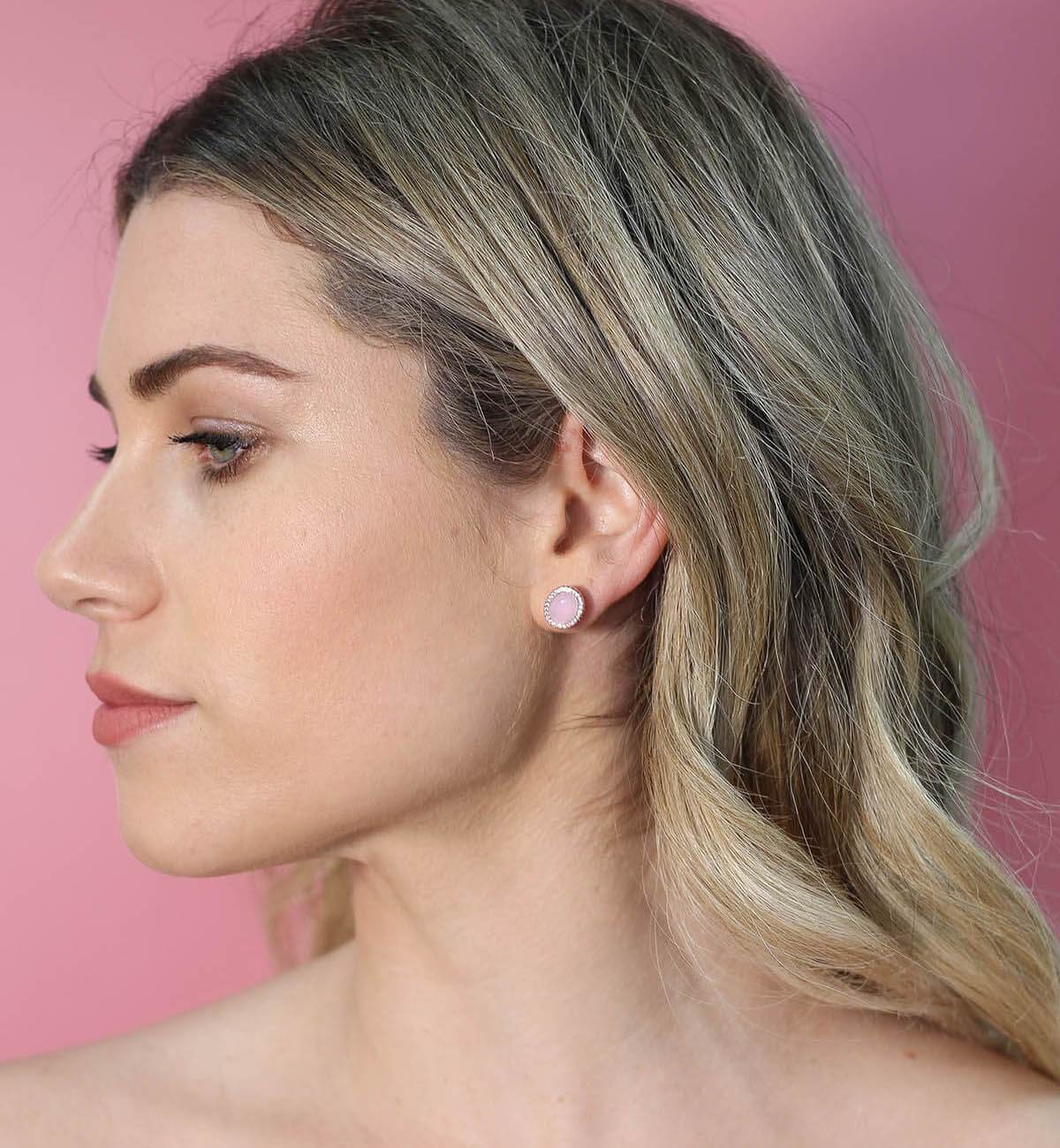 Elegant Glamour oval stud earrings featuring colorful cabochon stones and sparkling accents, available in various metal finishes.