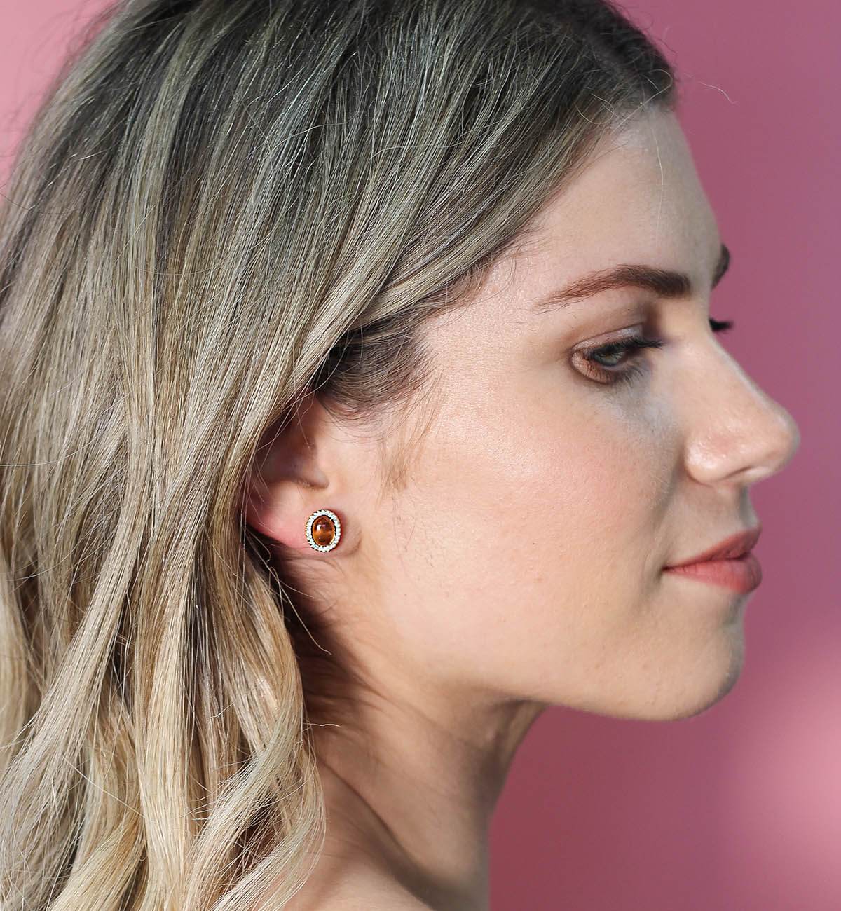 Elegant Glamour oval stud earrings featuring colorful cabochon stones and sparkling accents, available in various metal finishes.