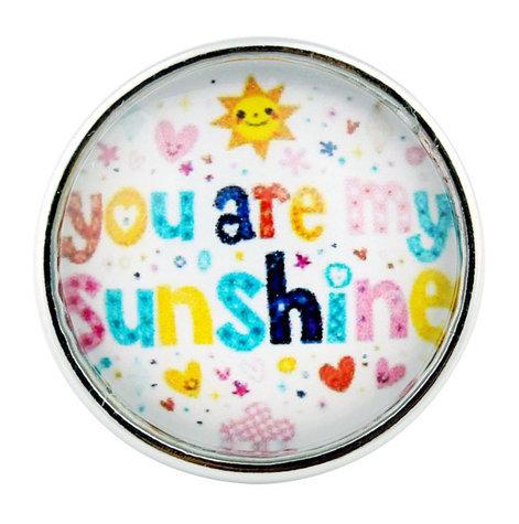 A beautiful glass domed snap featuring the phrase 'You Are My Sunshine', designed for snap jewelry customization.