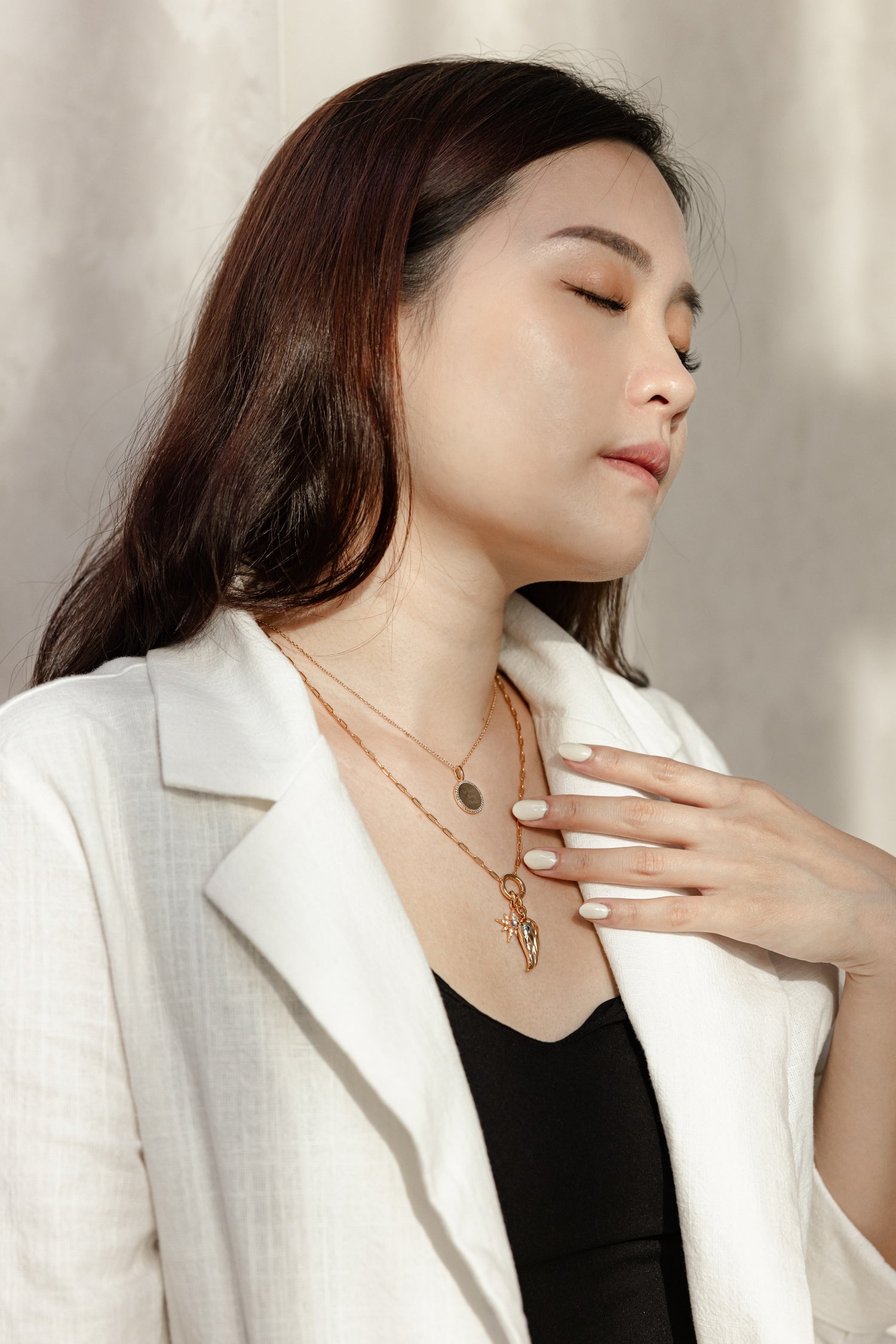 Gold Charm Carrier Necklace Chain with charms, showcasing its elegant design and versatility.