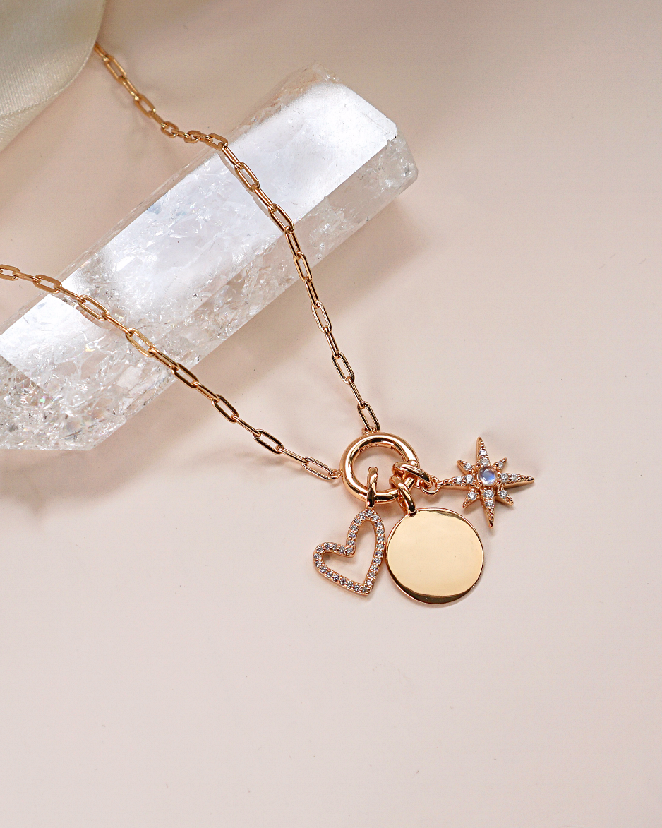 Gold Charm Carrier Necklace Chain with charms, showcasing its elegant design and versatility.