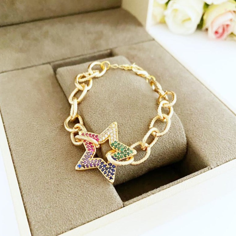 A stylish Gold Chunky Link Chain Bracelet featuring a sparkling Zircon Star charm, showcasing its handmade craftsmanship and adjustable design.