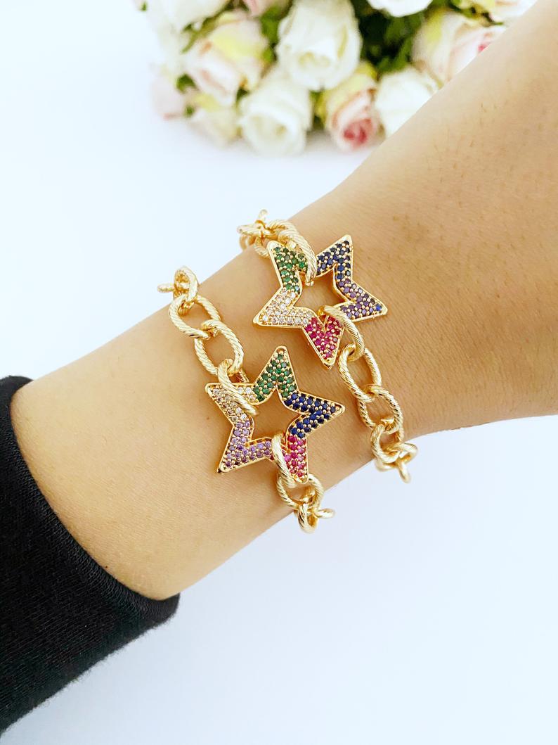 A stylish Gold Chunky Link Chain Bracelet featuring a sparkling Zircon Star charm, showcasing its handmade craftsmanship and adjustable design.