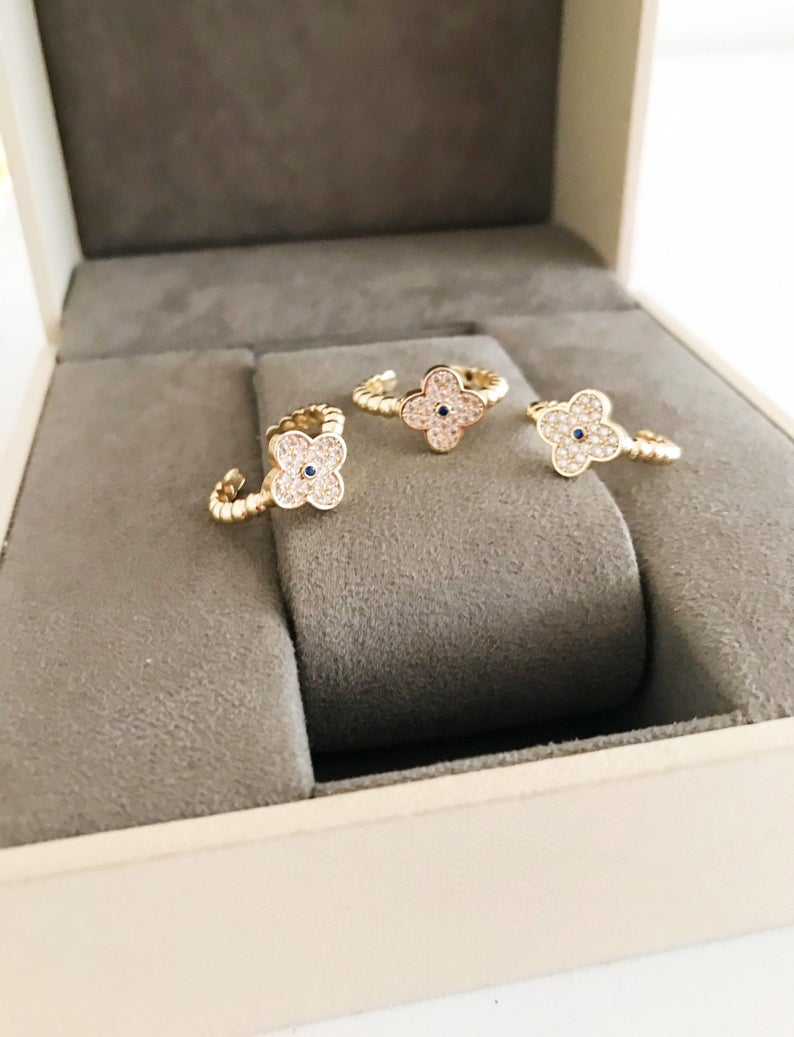 Adjustable Gold Clover Ring featuring a four-leaf clover charm and sparkling zirconia beads, perfect for lucky jewelry.