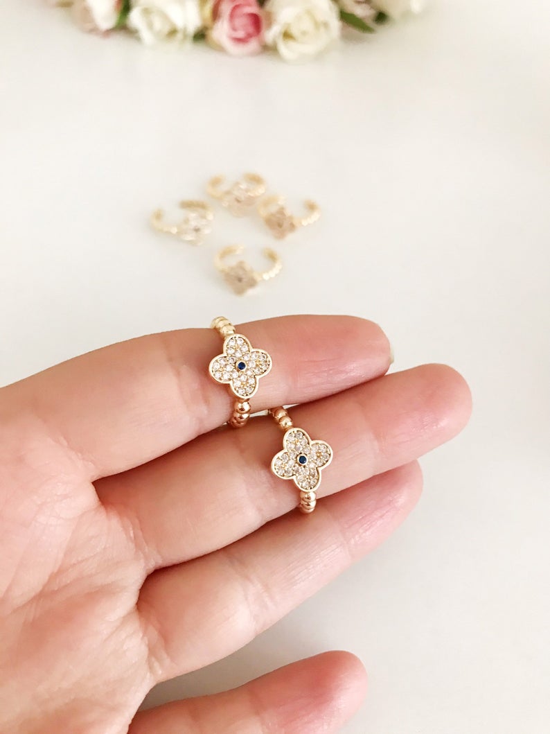 Adjustable Gold Clover Ring featuring a four-leaf clover charm and sparkling zirconia beads, perfect for lucky jewelry.