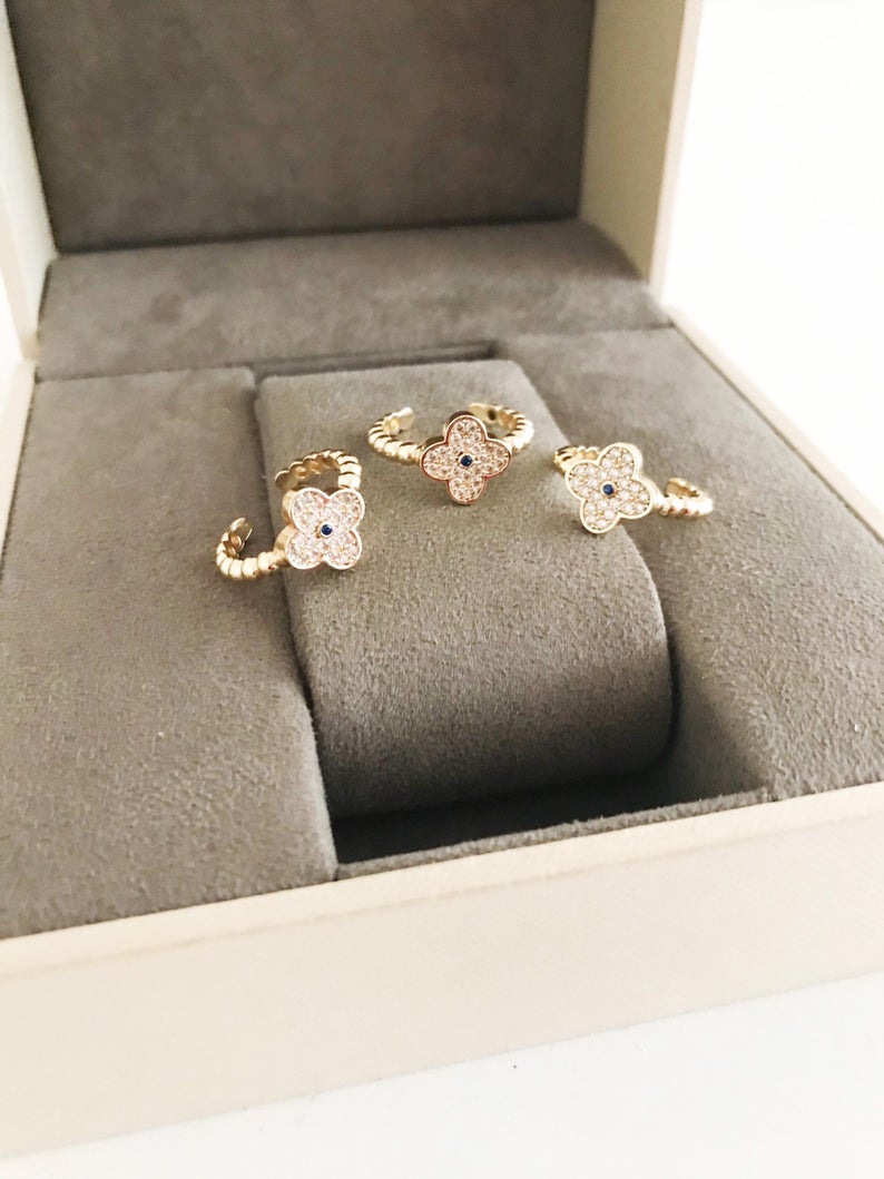 Adjustable Gold Clover Ring featuring a four-leaf clover charm and sparkling zirconia beads, perfect for lucky jewelry.