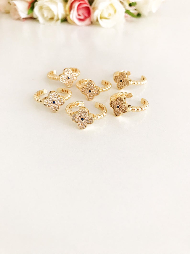 Adjustable Gold Clover Ring featuring a four-leaf clover charm and sparkling zirconia beads, perfect for lucky jewelry.