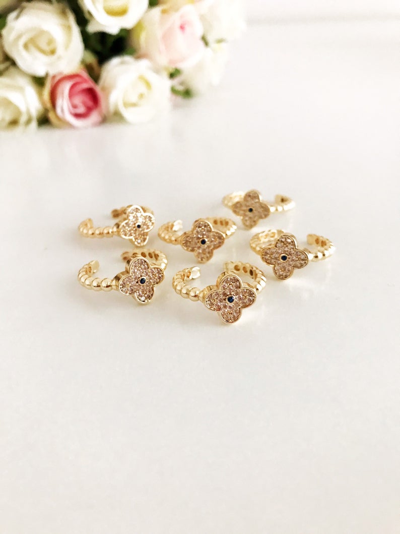 Adjustable Gold Clover Ring featuring a four-leaf clover charm and sparkling zirconia beads, perfect for lucky jewelry.