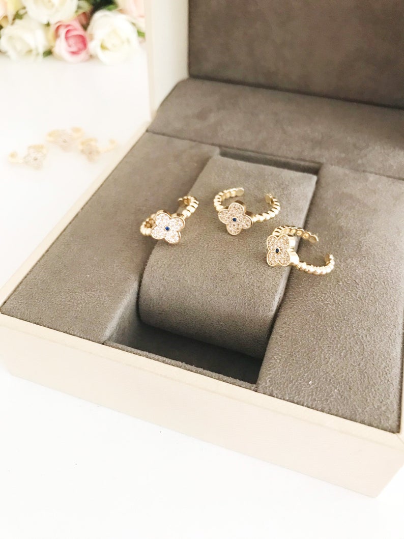 Adjustable Gold Clover Ring featuring a four-leaf clover charm and sparkling zirconia beads, perfect for lucky jewelry.