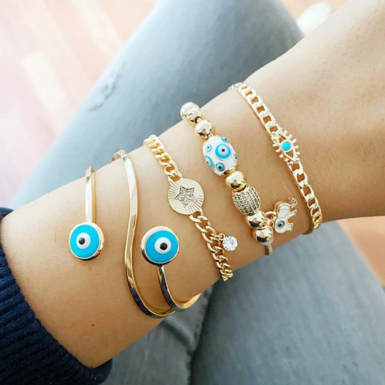 A beautiful Gold Evil Eye Bracelet featuring a blue evil eye bead, adjustable stainless steel design, perfect for everyday wear.