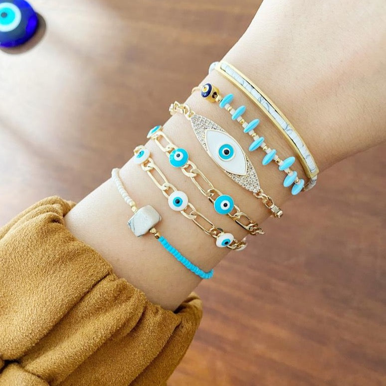 Gold Evil Eye Bracelet featuring vibrant seed beads and adjustable stainless steel design, perfect for everyday wear.