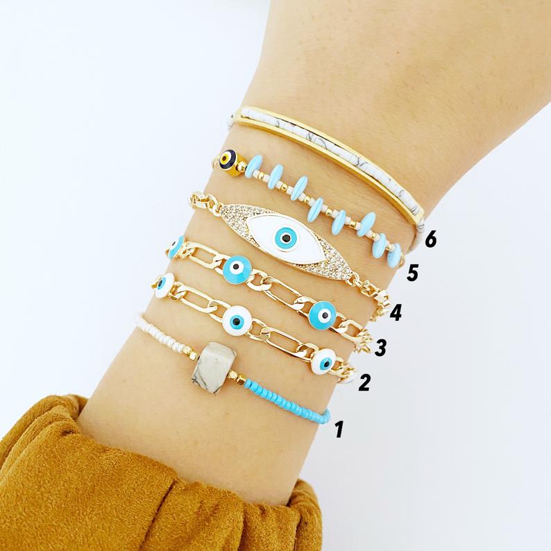 Gold Evil Eye Bracelet featuring vibrant seed beads and adjustable stainless steel design, perfect for everyday wear.