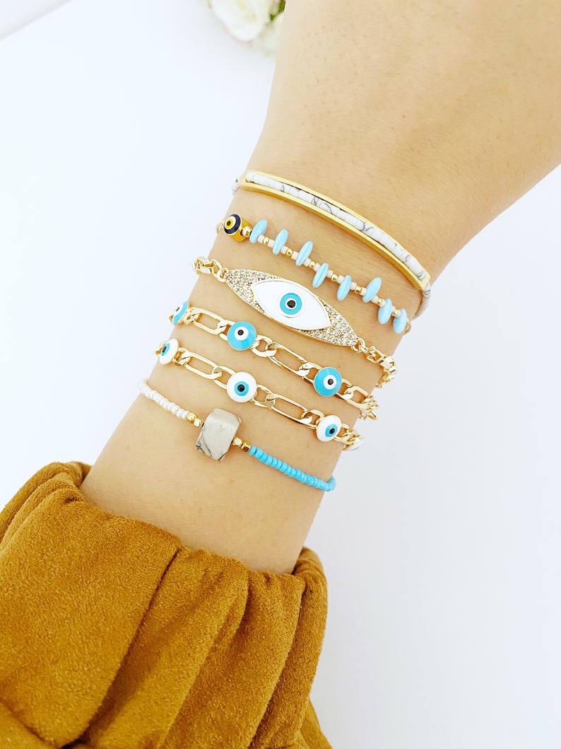 Gold Evil Eye Bracelet featuring vibrant seed beads and adjustable stainless steel design, perfect for everyday wear.