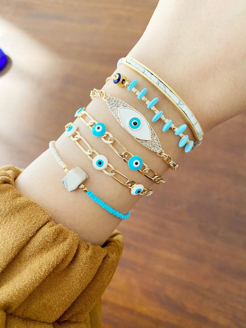 Gold Evil Eye Bracelet featuring vibrant seed beads and adjustable stainless steel design, perfect for everyday wear.