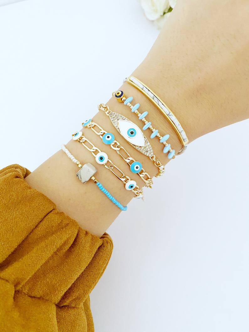 Gold Evil Eye Bracelet featuring vibrant seed beads and adjustable stainless steel design, perfect for everyday wear.