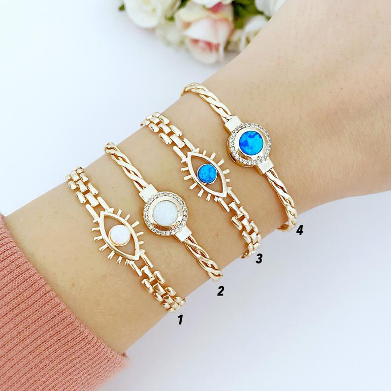 Gold Evil Eye Bracelet featuring blue and white opal beads, handmade with adjustable stainless steel material.