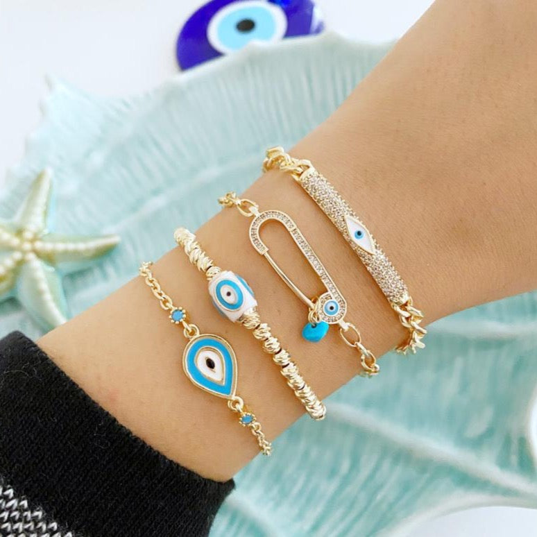 Gold Evil Eye Bracelet featuring zirconia dorica beads and adjustable stainless steel design, perfect for protection and style.