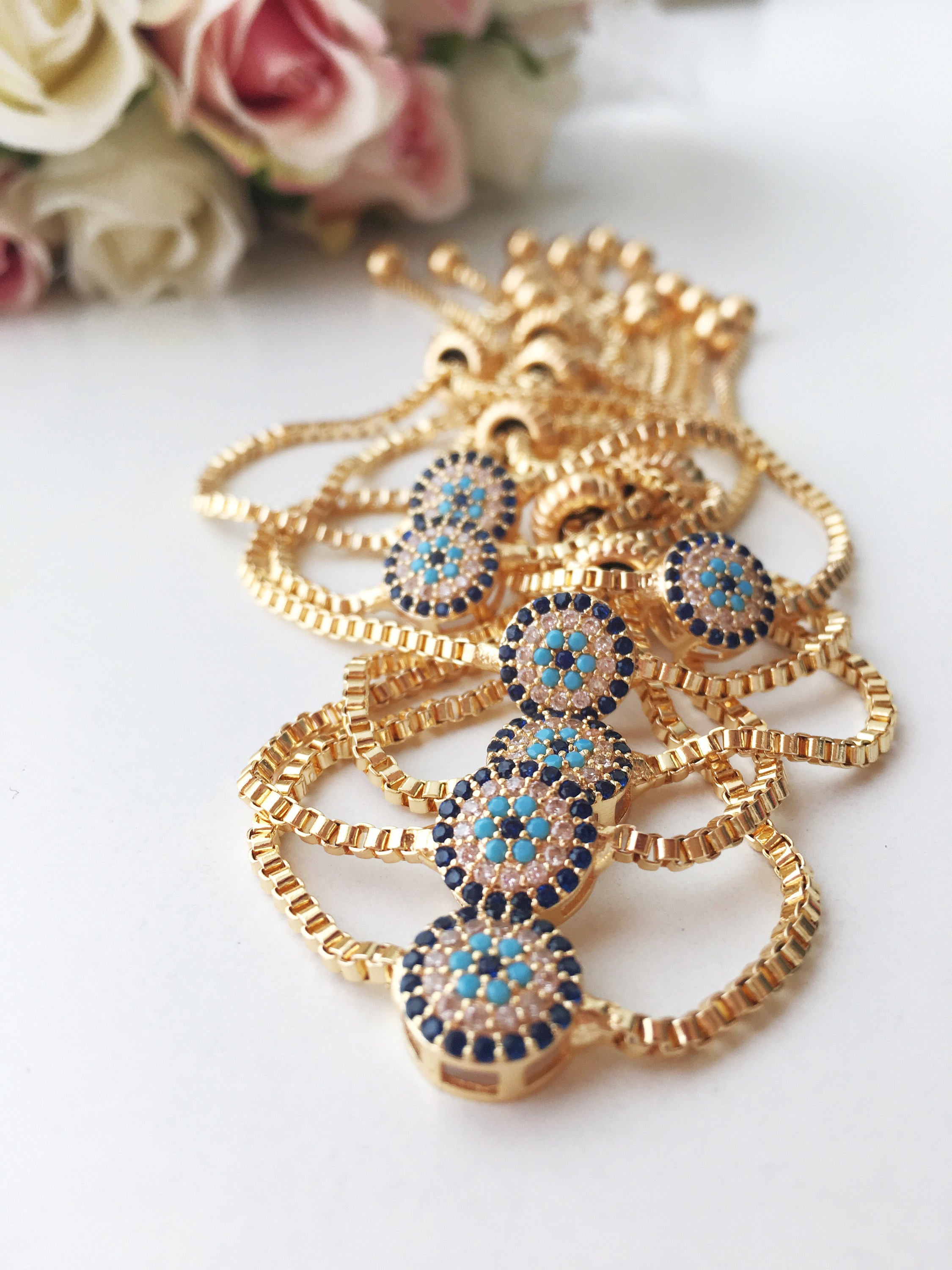 Gold Evil Eye Bracelet featuring a tiny evil eye bead, adjustable design, and made from tarnish-resistant stainless steel.