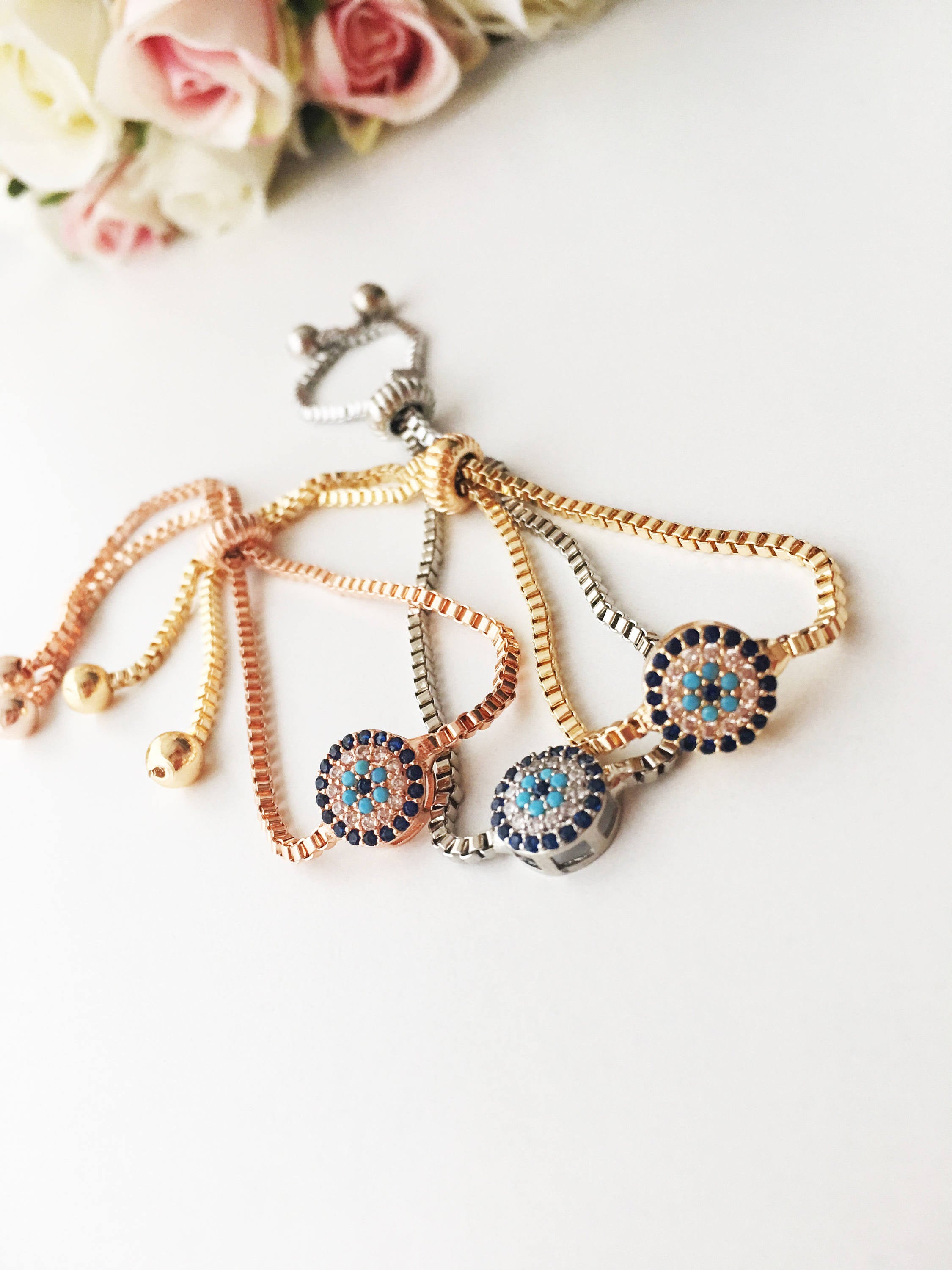 Gold Evil Eye Bracelet featuring a tiny evil eye bead, adjustable design, and made from tarnish-resistant stainless steel.