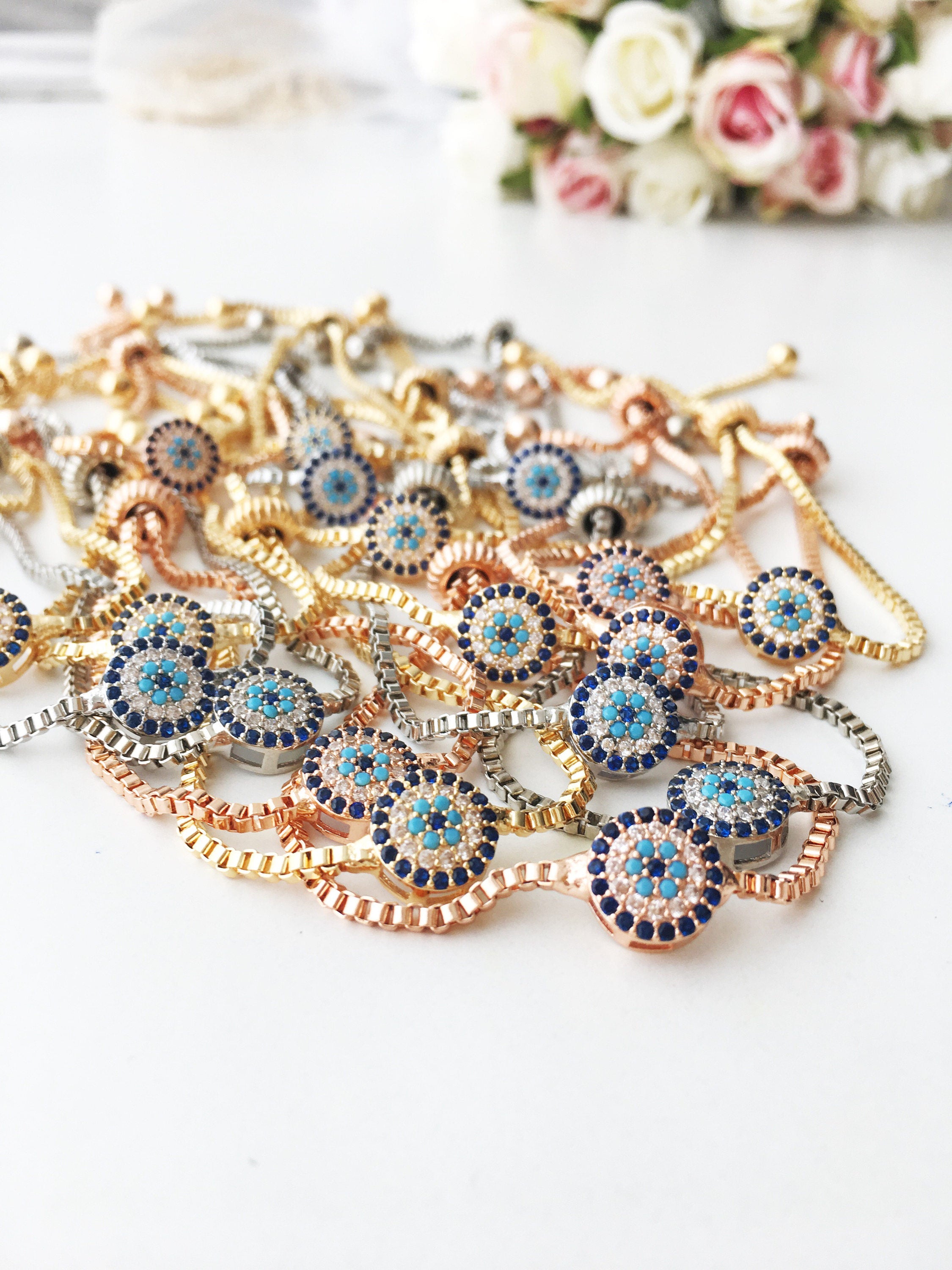 Gold Evil Eye Bracelet featuring a tiny evil eye bead, adjustable design, and made from tarnish-resistant stainless steel.