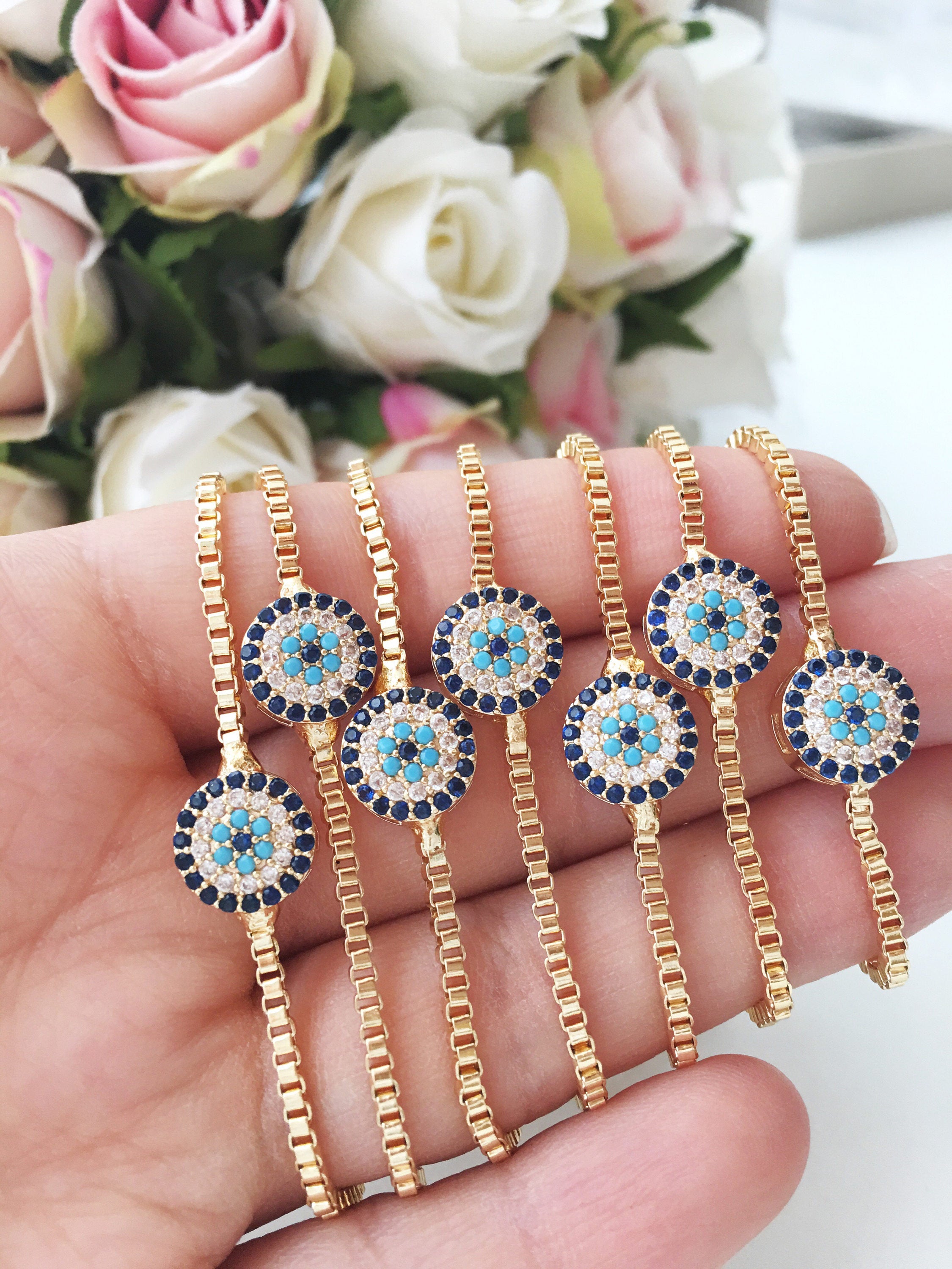 Gold Evil Eye Bracelet featuring a tiny evil eye bead, adjustable design, and made from tarnish-resistant stainless steel.