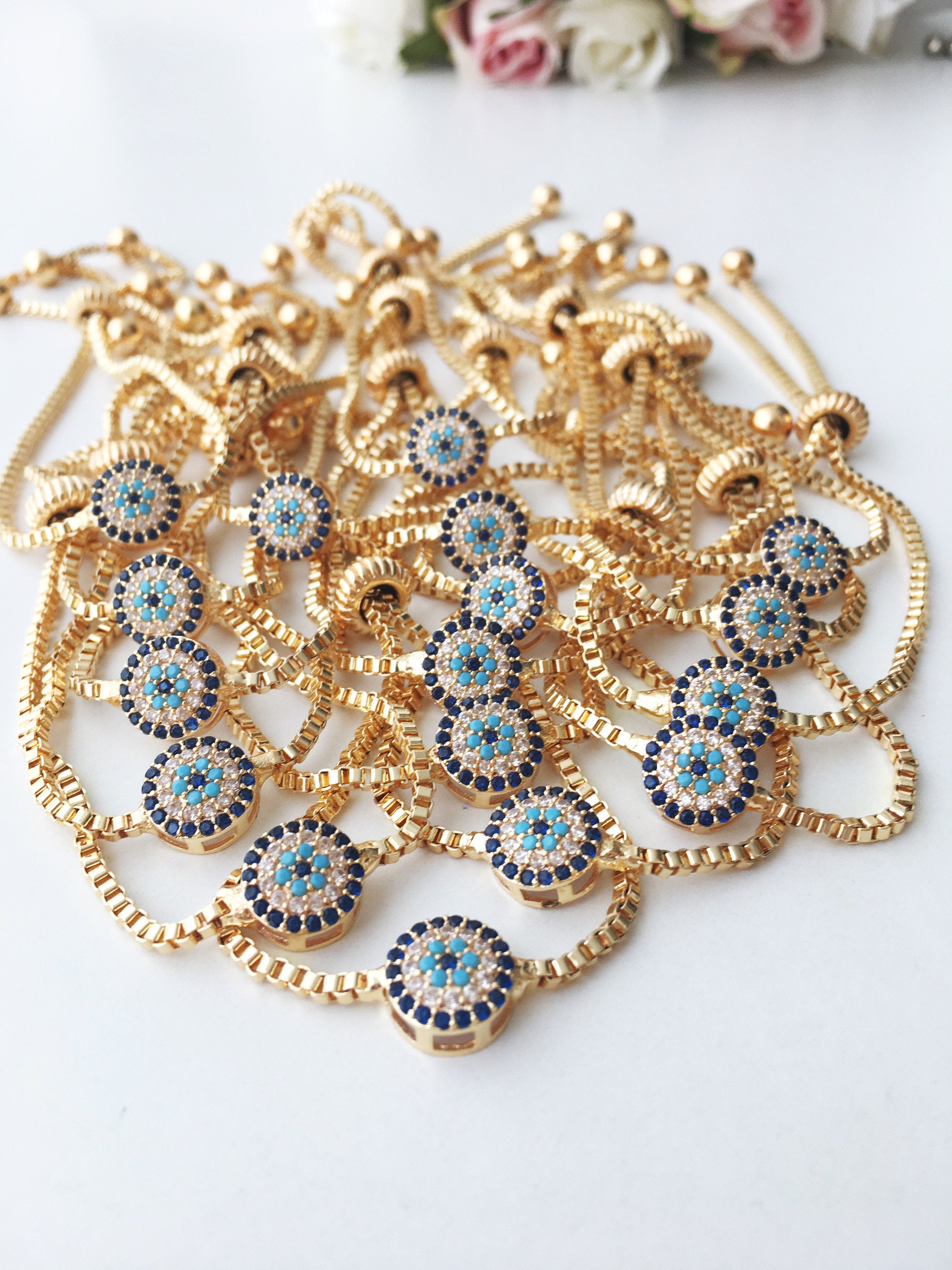 Gold Evil Eye Bracelet featuring a tiny evil eye bead, adjustable design, and made from tarnish-resistant stainless steel.