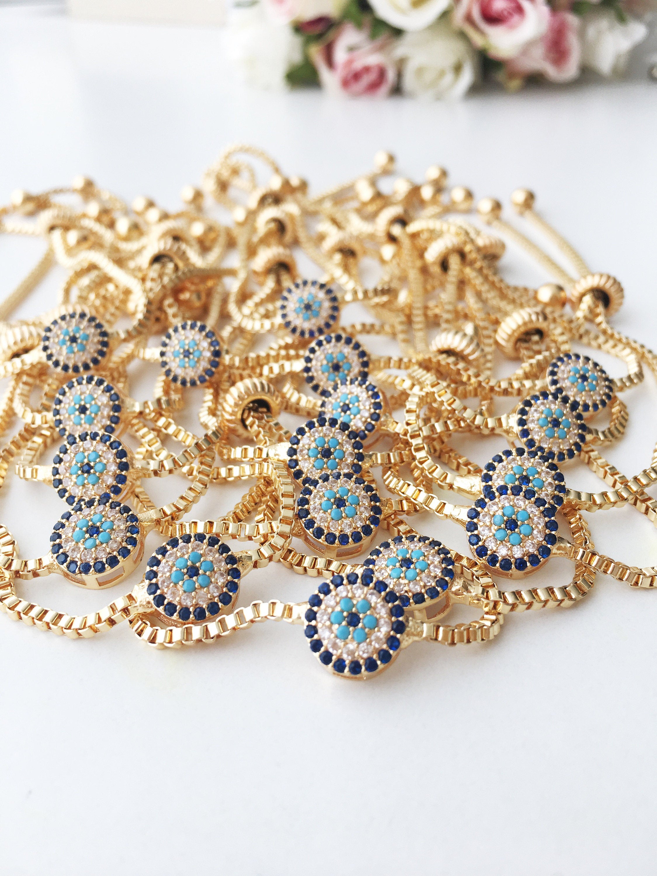 Gold Evil Eye Bracelet featuring a tiny evil eye bead, adjustable design, and made from tarnish-resistant stainless steel.