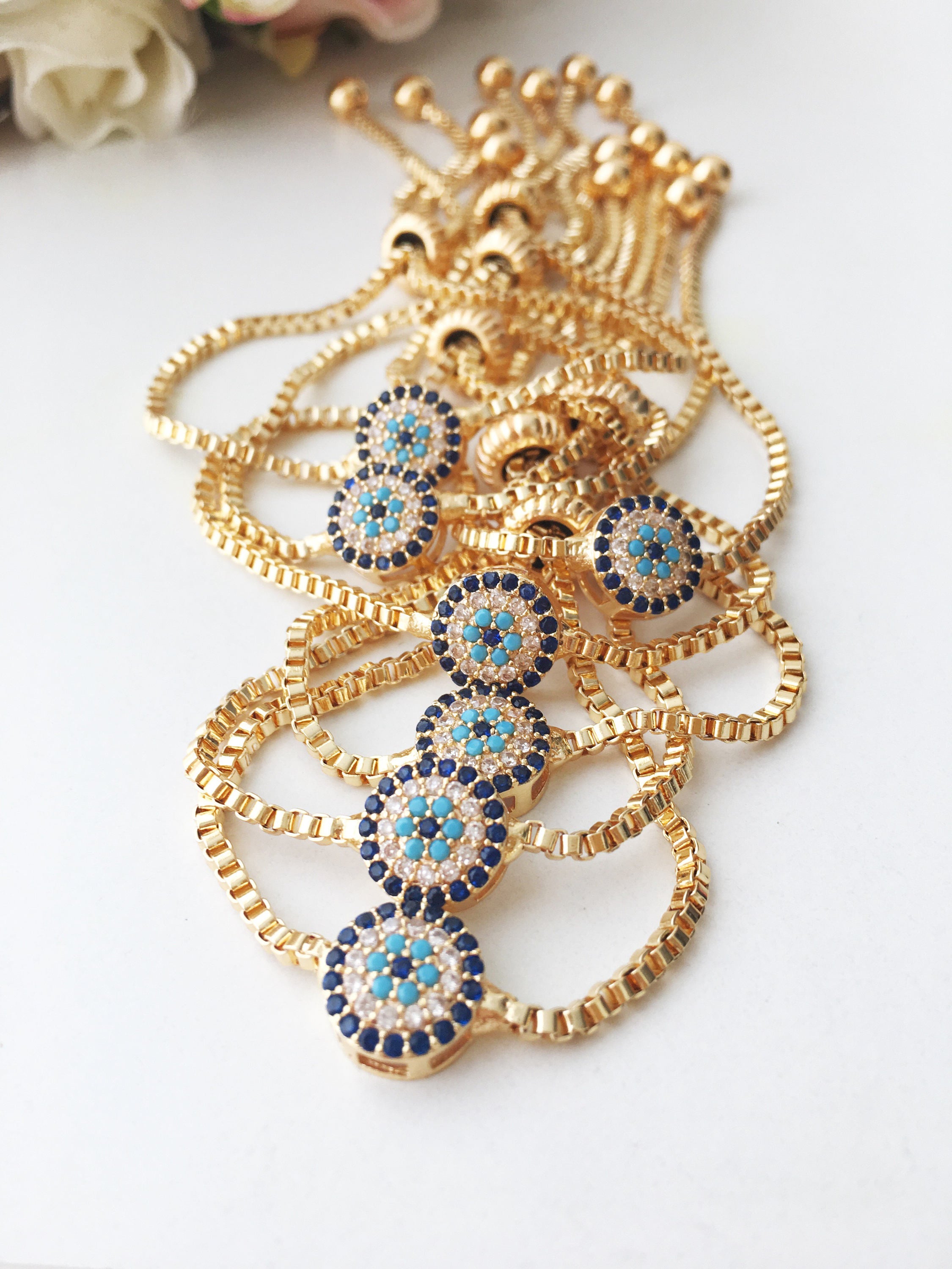 Gold Evil Eye Bracelet featuring a tiny evil eye bead, adjustable design, and made from tarnish-resistant stainless steel.