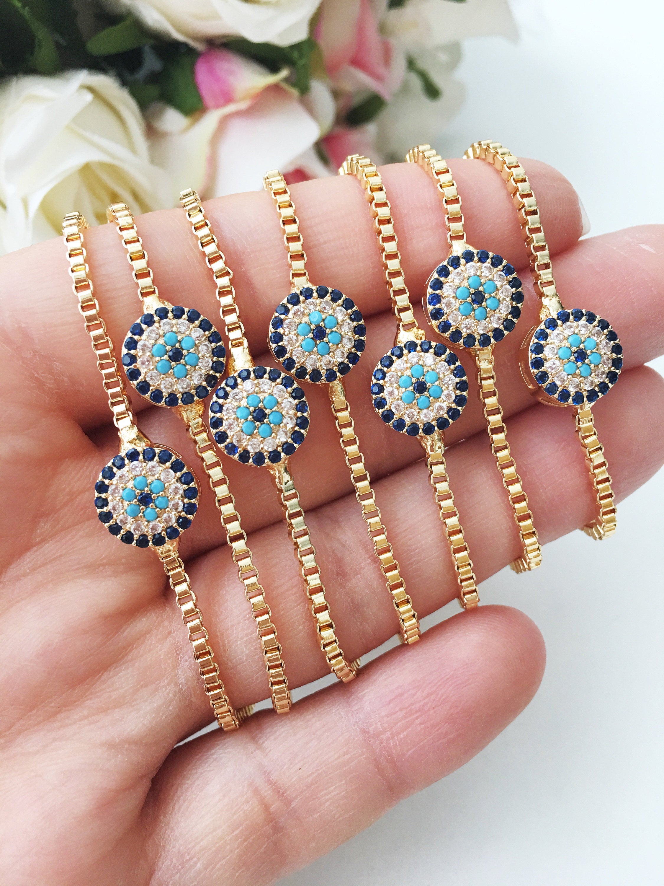 Gold Evil Eye Bracelet featuring a tiny evil eye bead, adjustable design, and made from tarnish-resistant stainless steel.