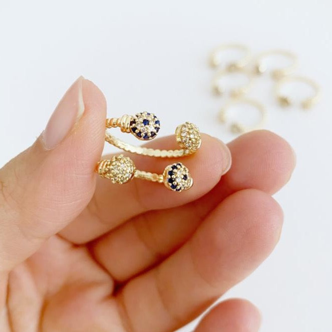 A beautiful Gold Evil Eye Ring featuring a 6mm zircon evil eye bead, adjustable design for all sizes, perfect for stacking or wearing alone.