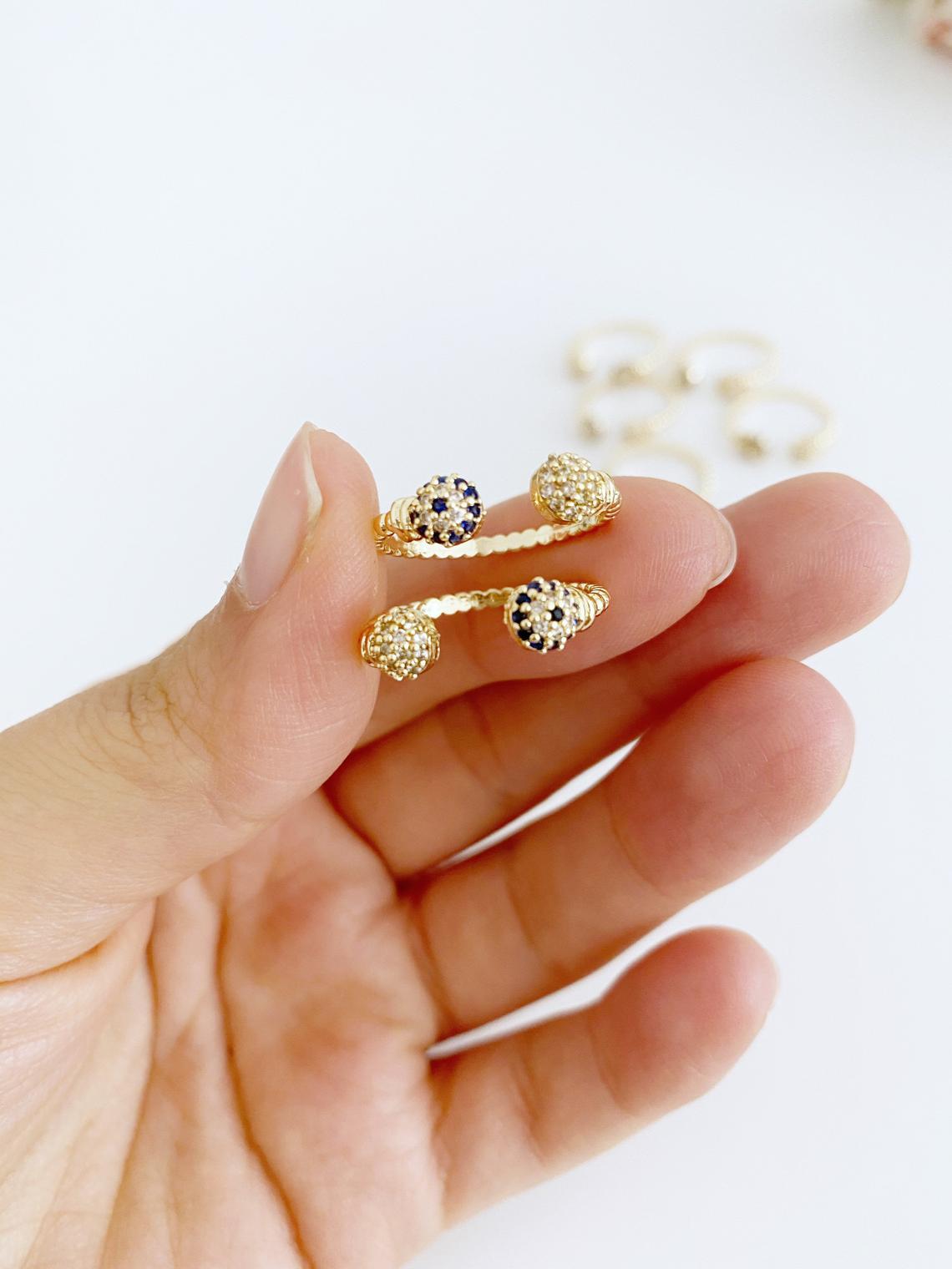 A beautiful Gold Evil Eye Ring featuring a 6mm zircon evil eye bead, adjustable design for all sizes, perfect for stacking or wearing alone.