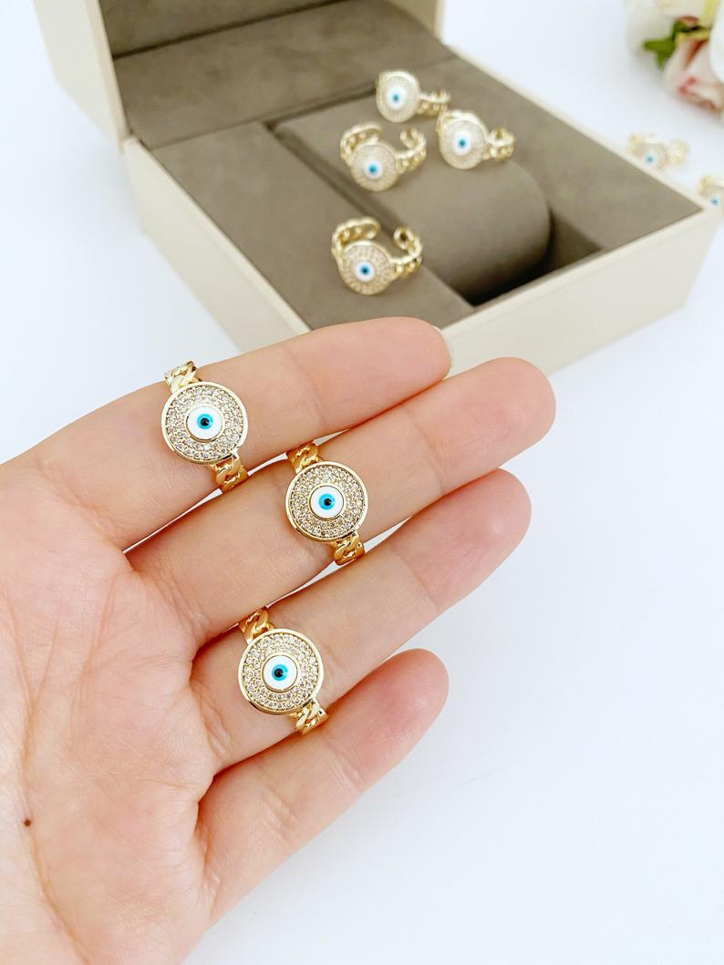 Gold Evil Eye Ring featuring a curb chain and zircon charm, adjustable design for all sizes, tarnish resistant finish.