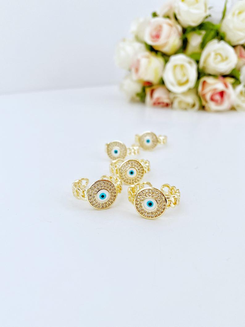 Gold Evil Eye Ring featuring a curb chain and zircon charm, adjustable design for all sizes, tarnish resistant finish.