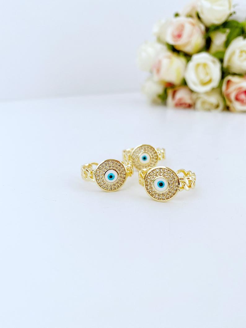 Gold Evil Eye Ring featuring a curb chain and zircon charm, adjustable design for all sizes, tarnish resistant finish.