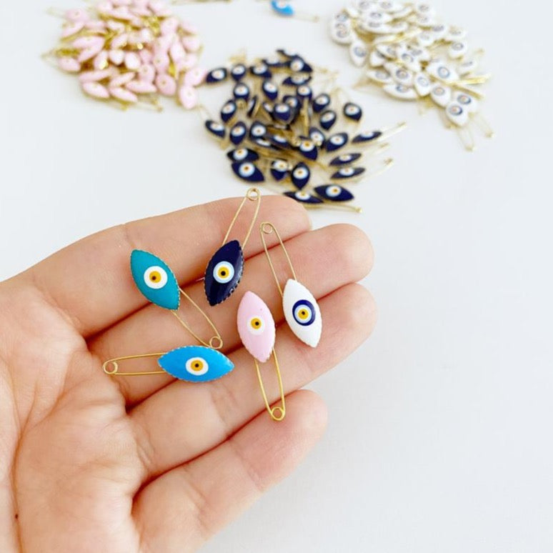 Gold Evil Eye Safety Pin featuring a blue evil eye charm, perfect for weddings and baby showers.
