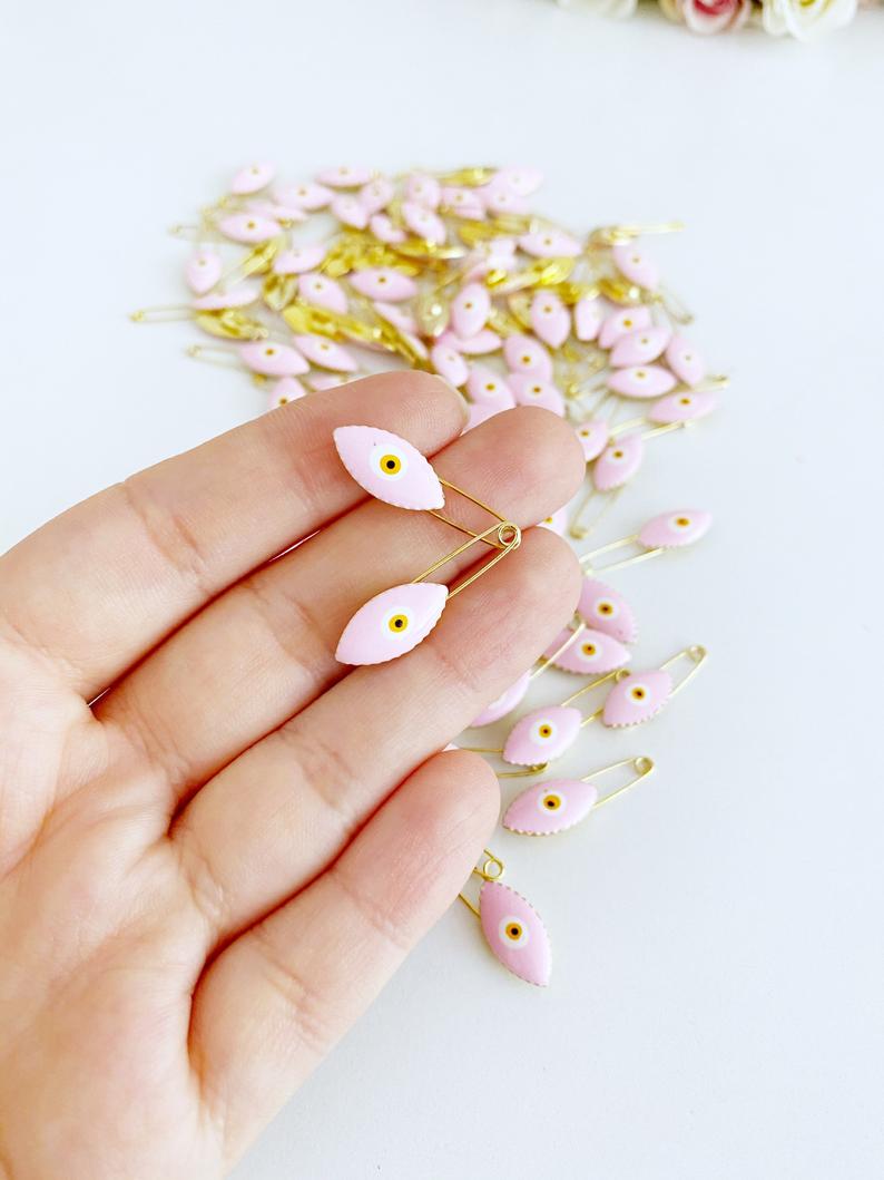 Gold Evil Eye Safety Pin featuring a blue evil eye charm, perfect for weddings and baby showers.