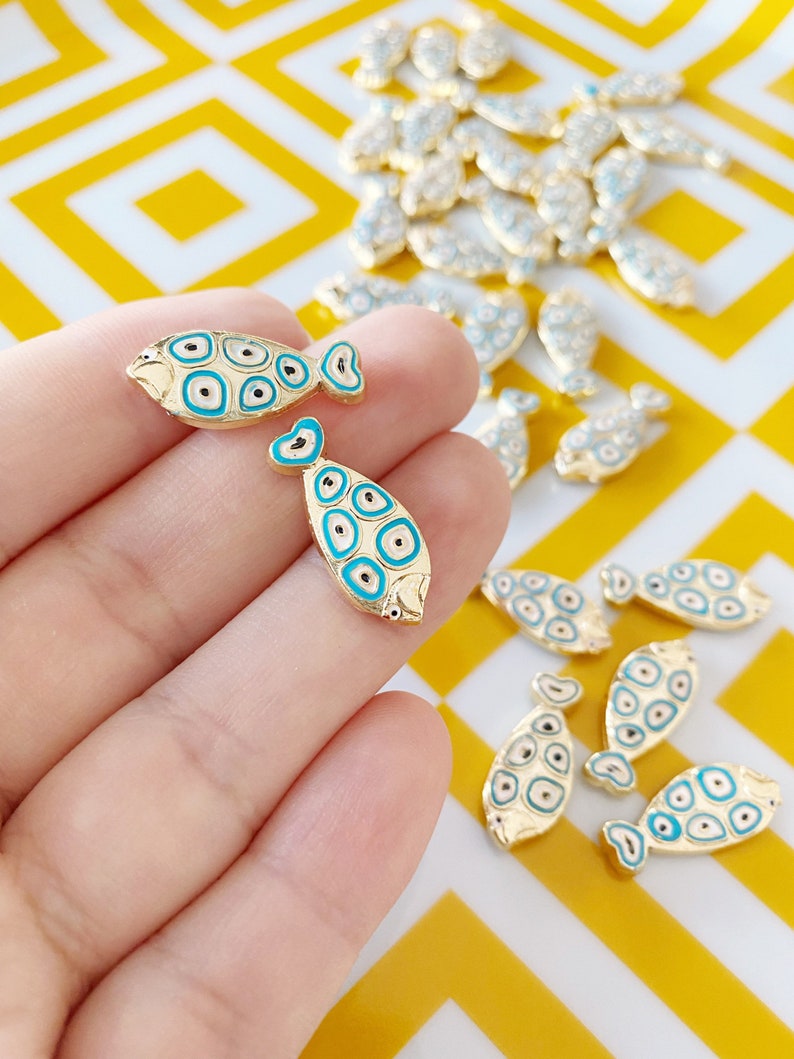 Gold Fish Charm Connector featuring a Blue Evil Eye design, made from stainless steel, ideal for DIY jewelry projects.