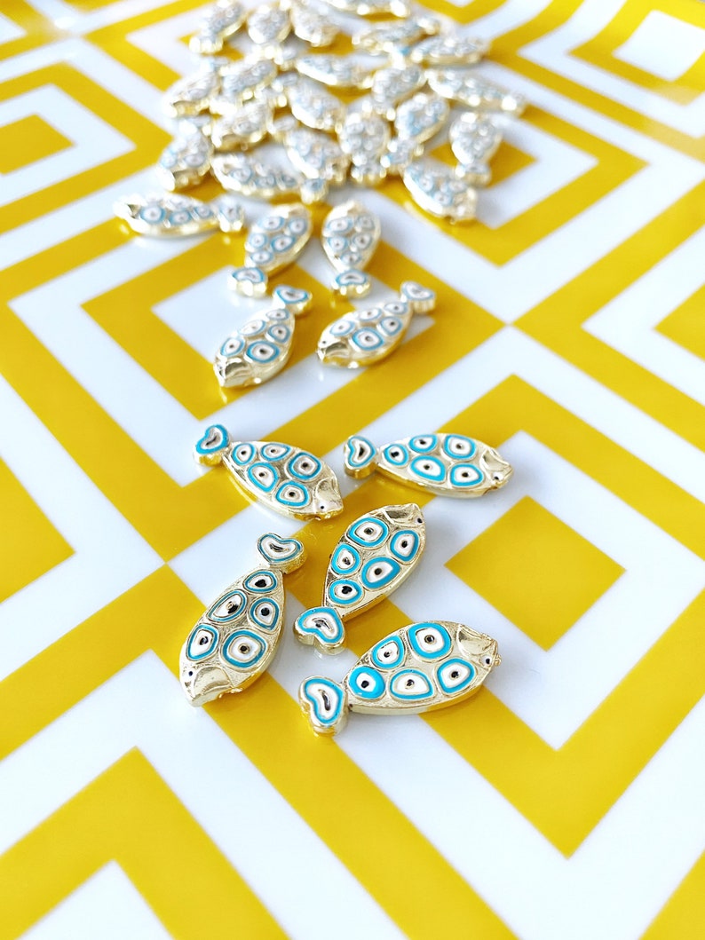 Gold Fish Charm Connector featuring a Blue Evil Eye design, made from stainless steel, ideal for DIY jewelry projects.