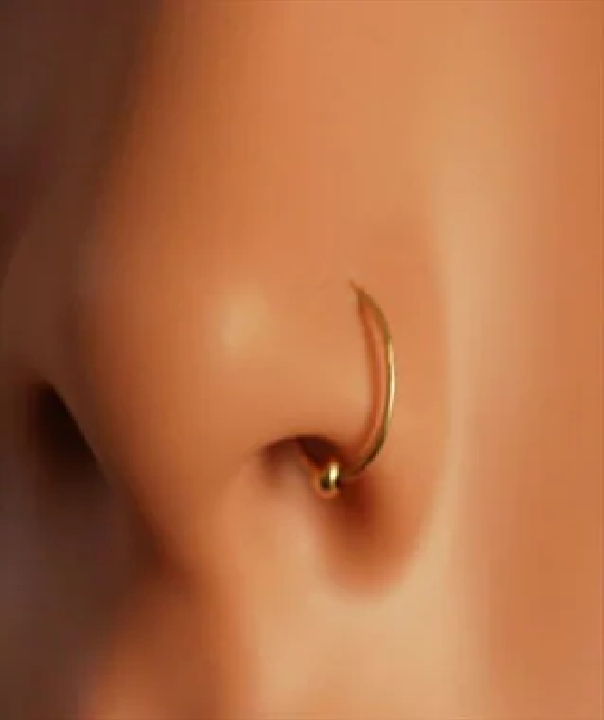 Elegant gold plated sterling silver nose ring with a ball closure, perfect for various piercings.