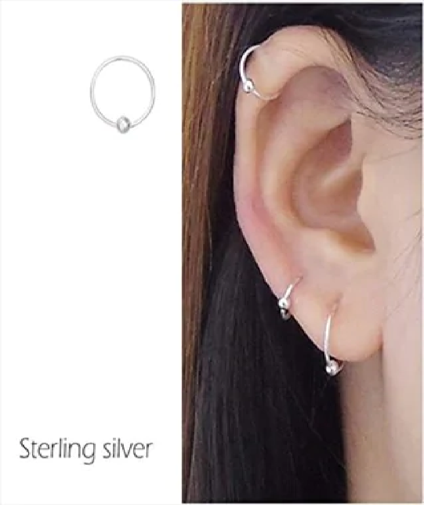 Elegant gold plated sterling silver nose ring with a ball closure, perfect for various piercings.