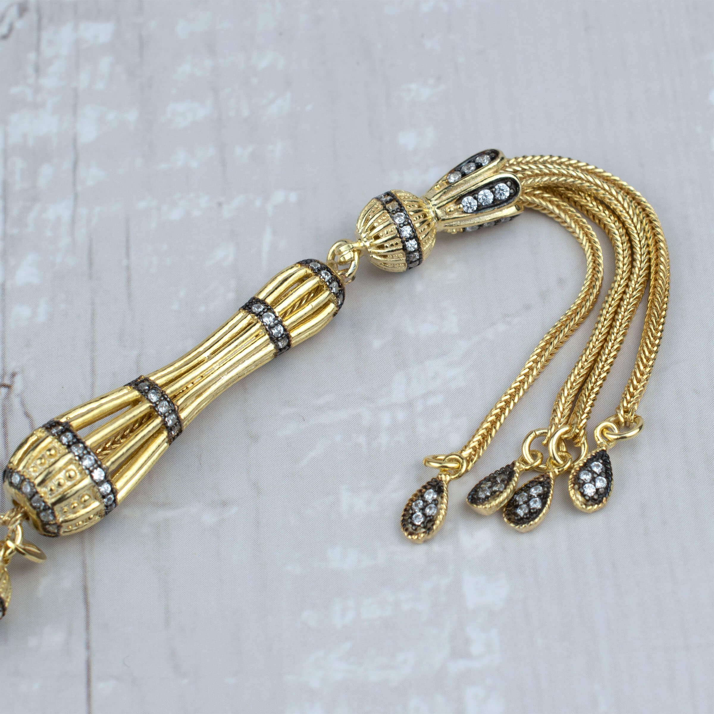 Gold Plated Sterling Silver Tasbih with 33 Zirconia beads, elegantly designed for prayer and meditation.