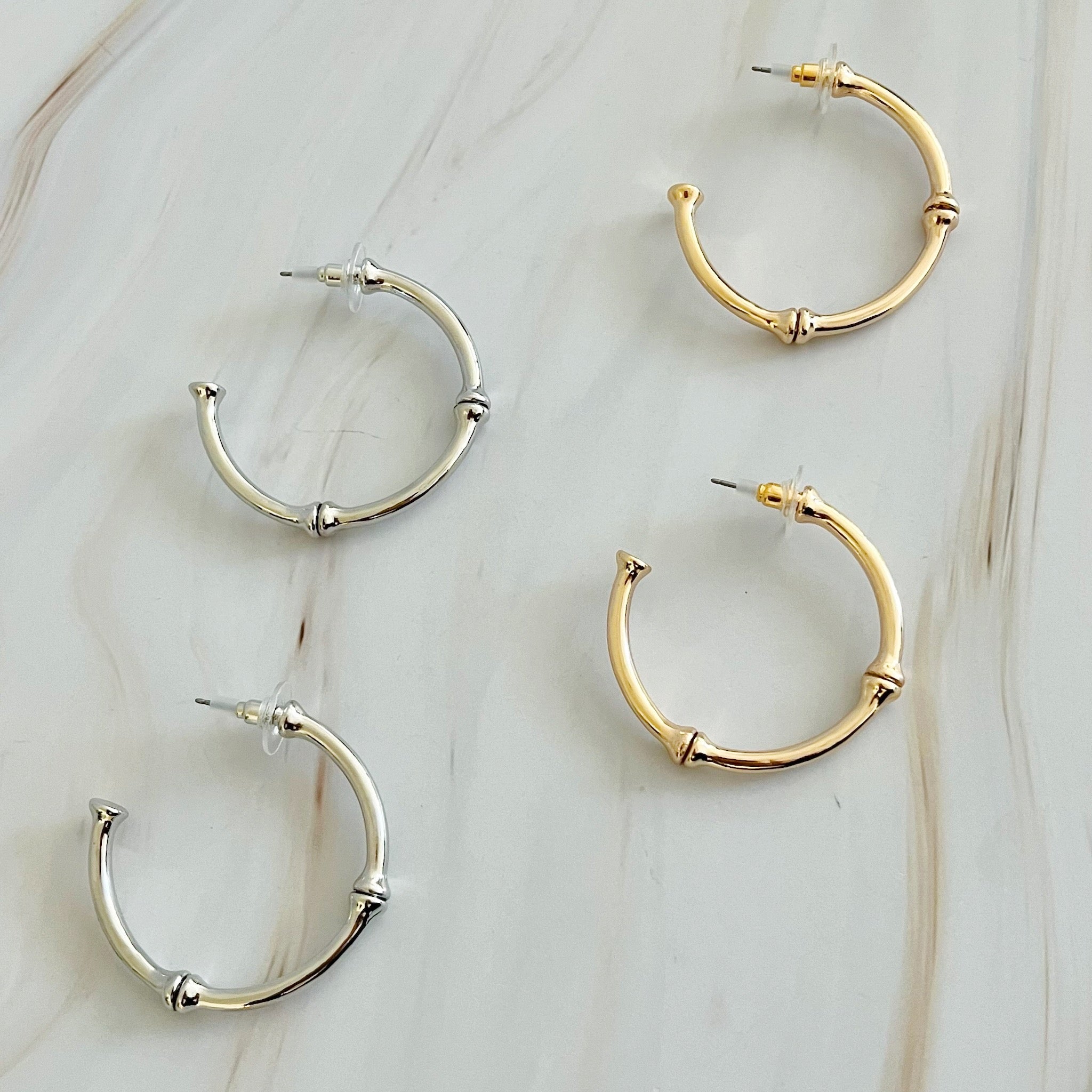 Golden Elegance Hoop Earrings showcasing a classic design with a modern twist, featuring a polished gold finish.