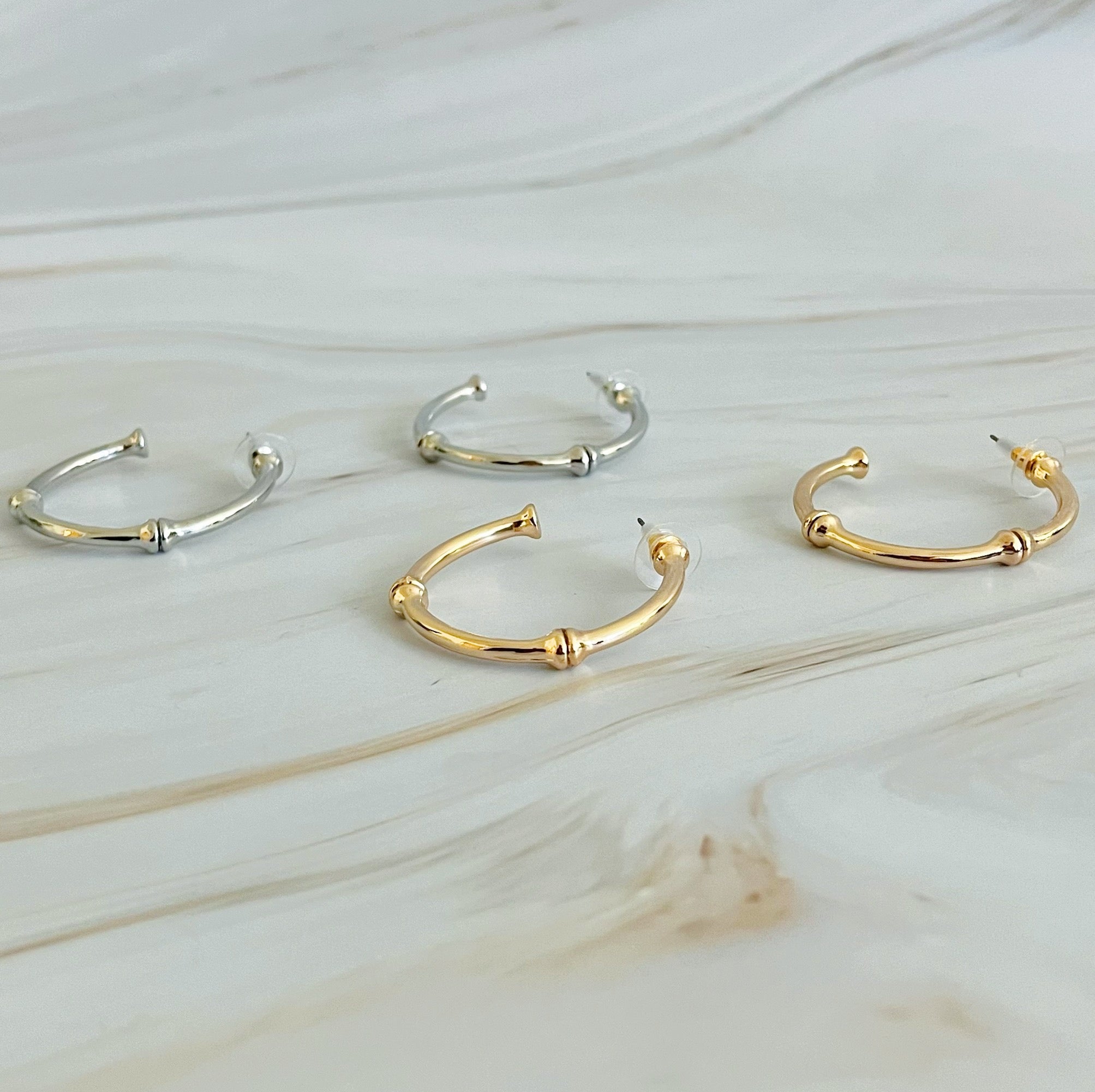 Golden Elegance Hoop Earrings showcasing a classic design with a modern twist, featuring a polished gold finish.