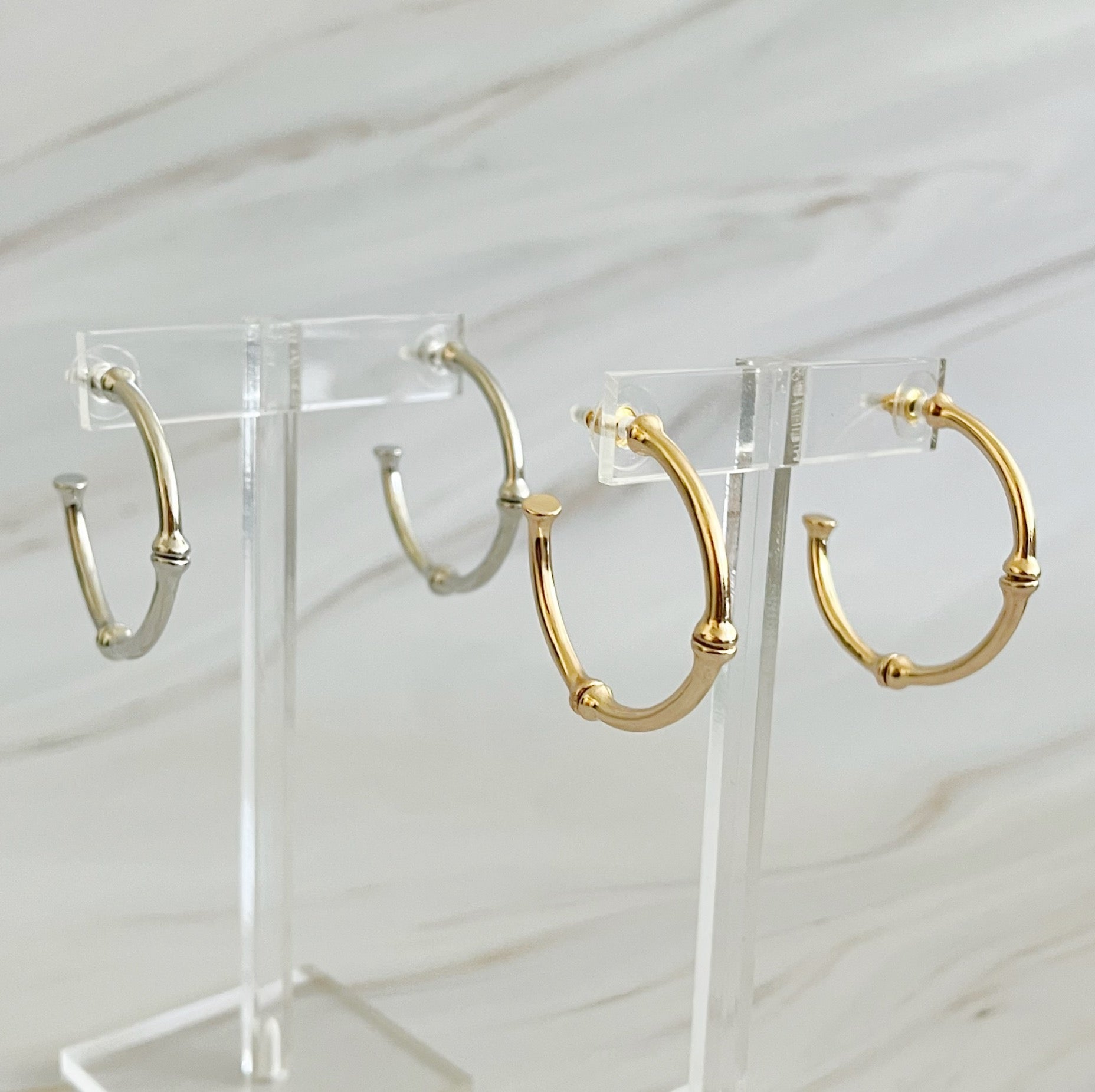 Golden Elegance Hoop Earrings showcasing a classic design with a modern twist, featuring a polished gold finish.