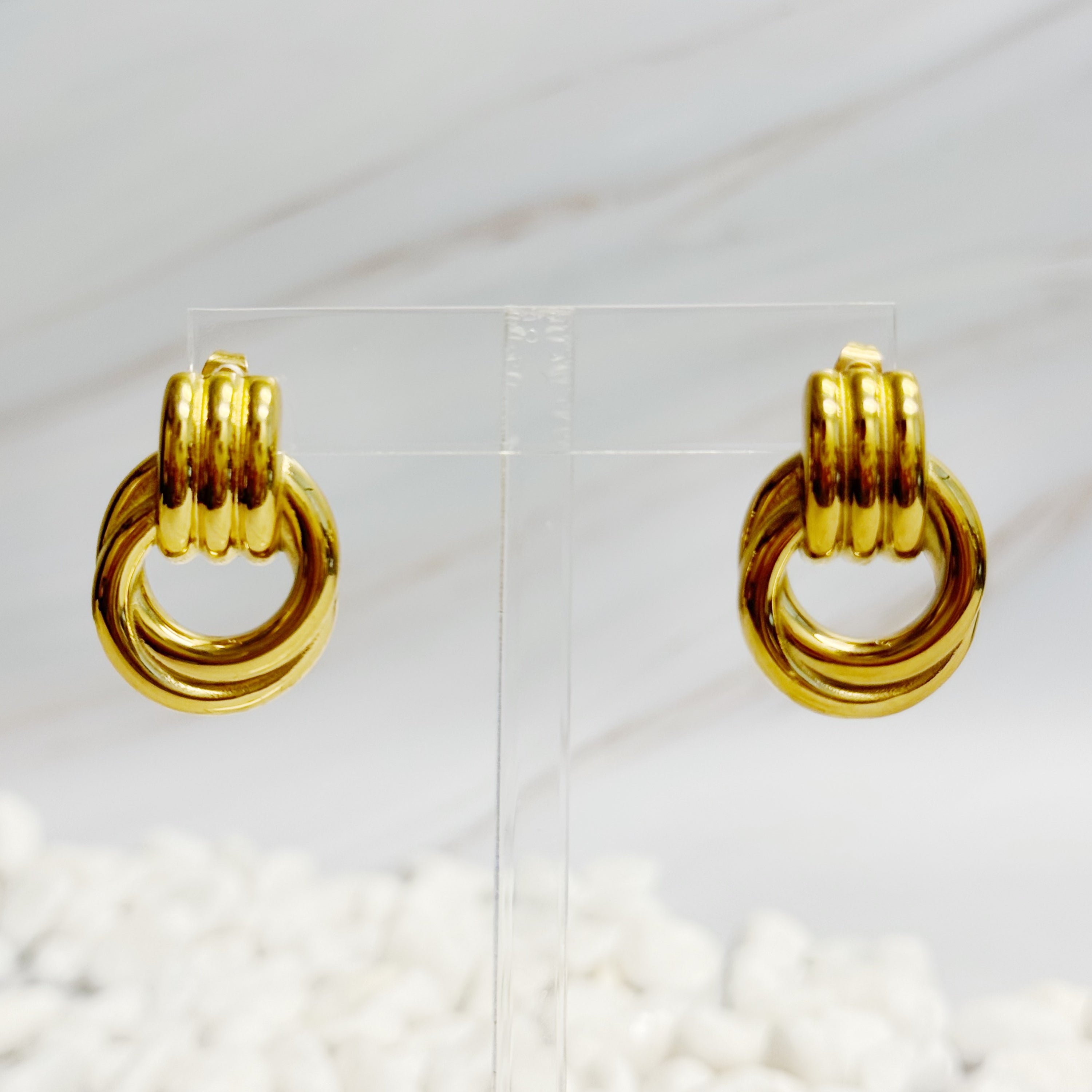 Elegant Golden Knocker Earrings featuring a modern knot design, crafted from 18k gold plated stainless steel.