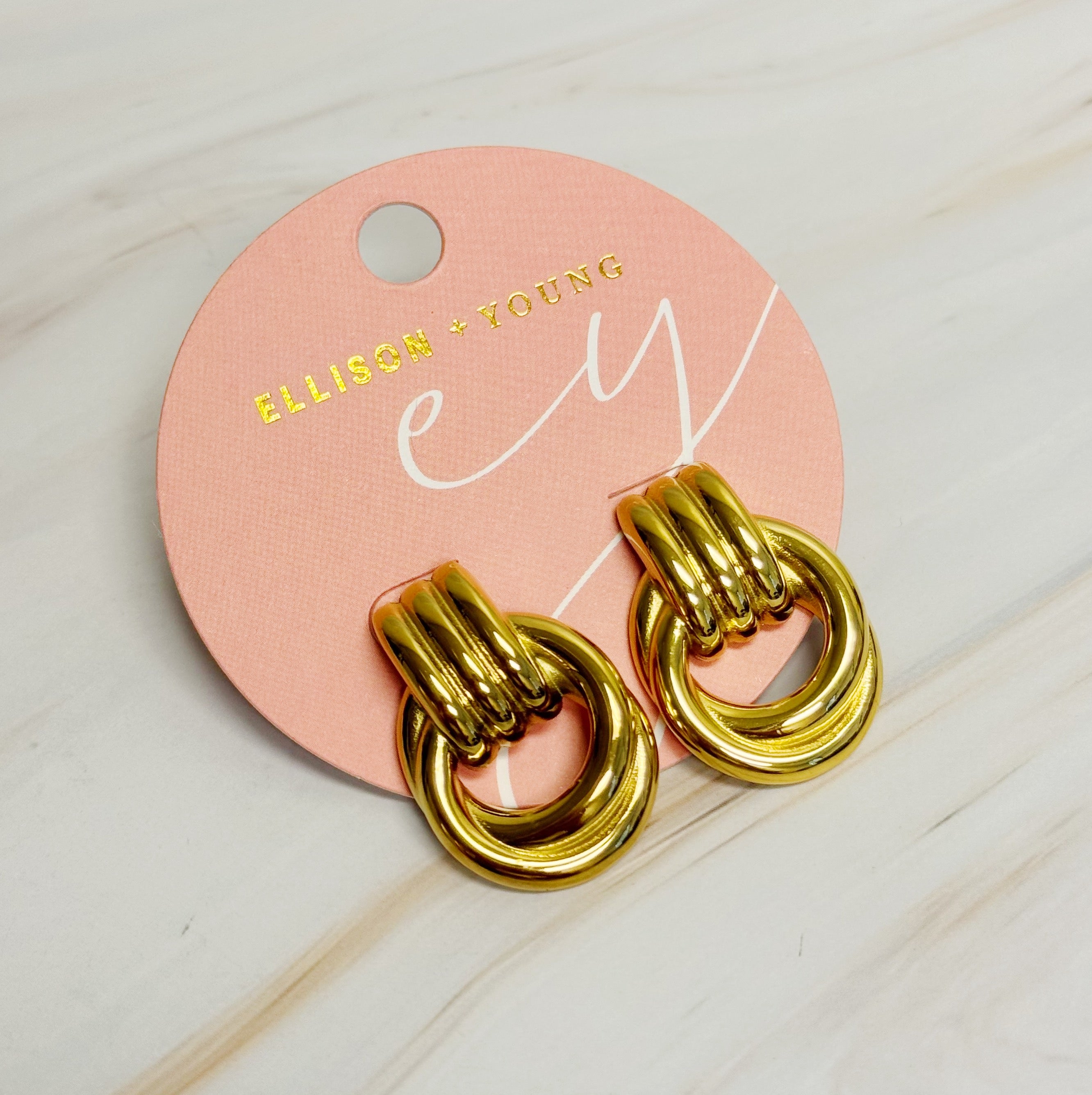 Elegant Golden Knocker Earrings featuring a modern knot design, crafted from 18k gold plated stainless steel.