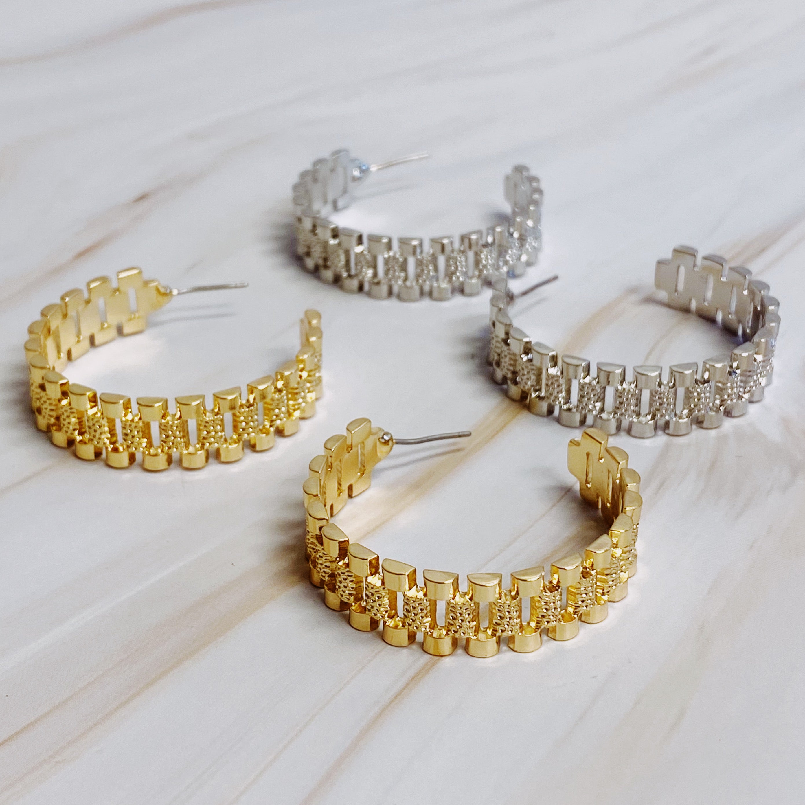 Elegant Golden Watch Band Hoop Earrings with a sleek design, perfect for any occasion.