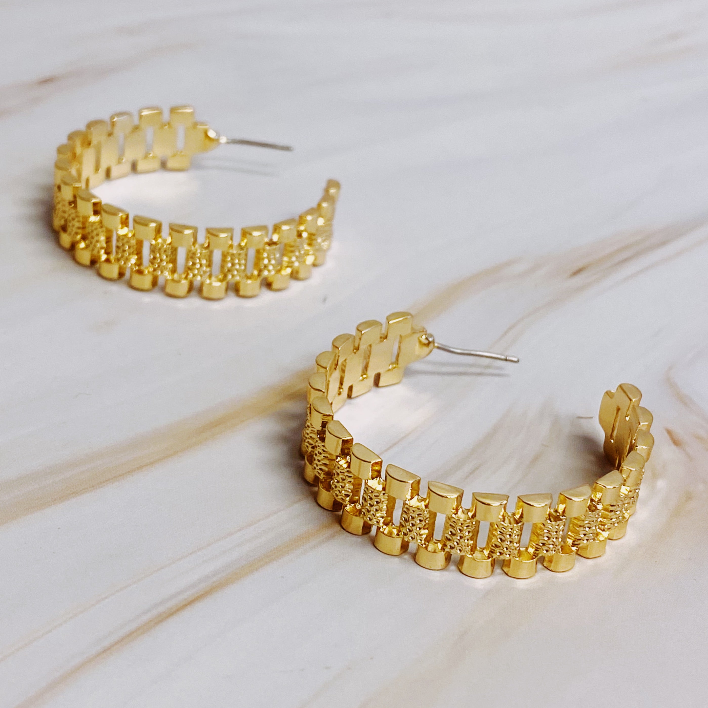 Elegant Golden Watch Band Hoop Earrings with a sleek design, perfect for any occasion.