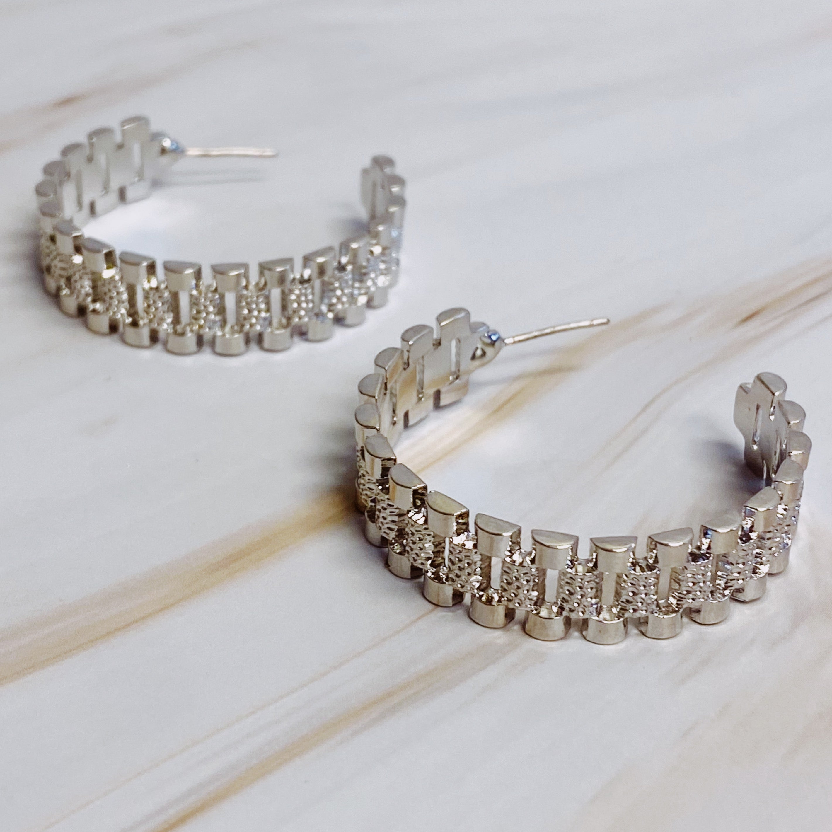Elegant Golden Watch Band Hoop Earrings with a sleek design, perfect for any occasion.