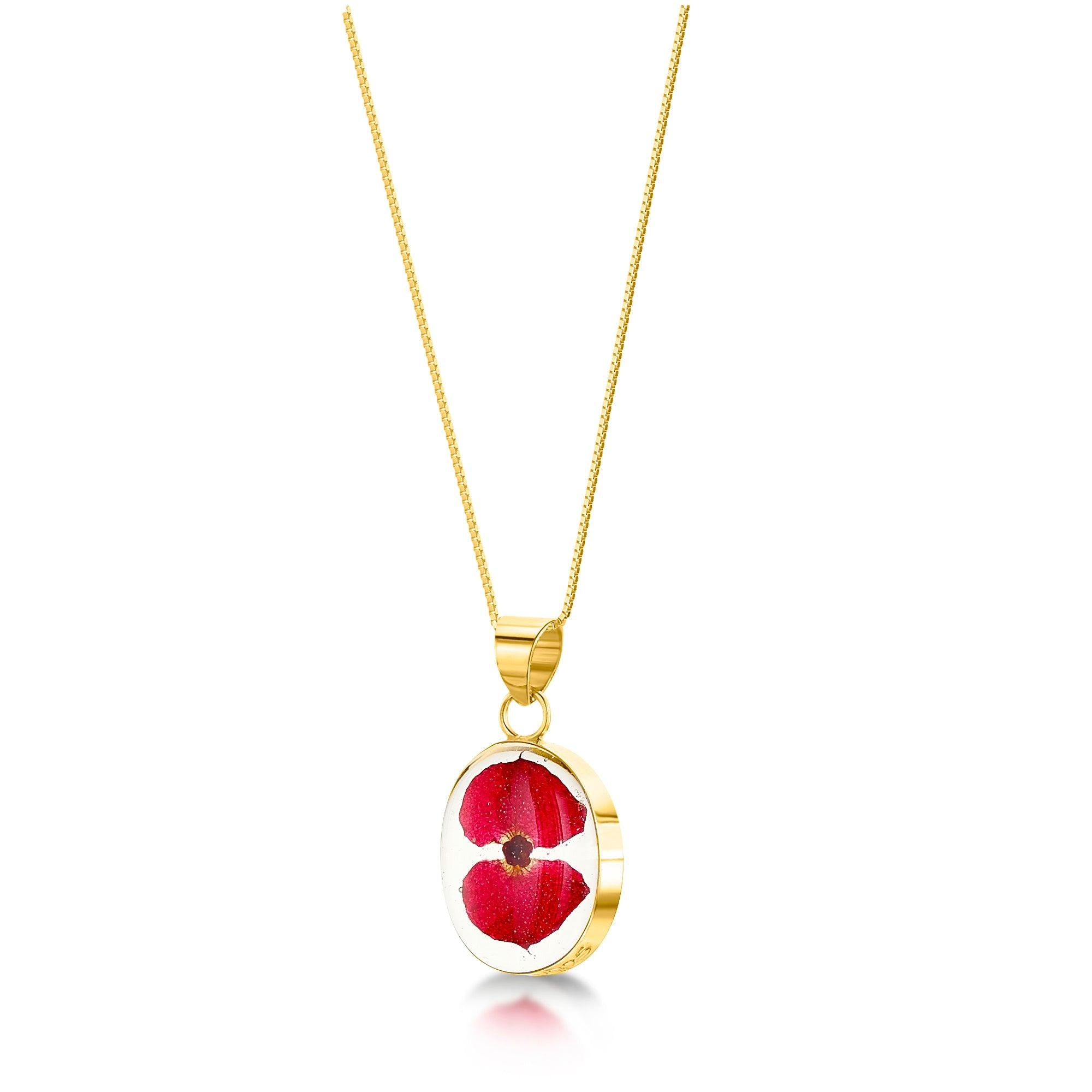 Gold-plated sterling silver oval pendant necklace featuring real poppy flowers, adjustable chain, and stylish gift box.